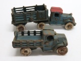 Two Cast Iron trucks, stake bed, 3 1/2