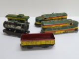 Five marx tin train cars and engines