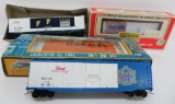 Four Model Railroad train cars, box cars