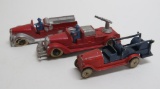 Two Tootsie Toy Fire Trucks and one unmarked pumper truck, 4