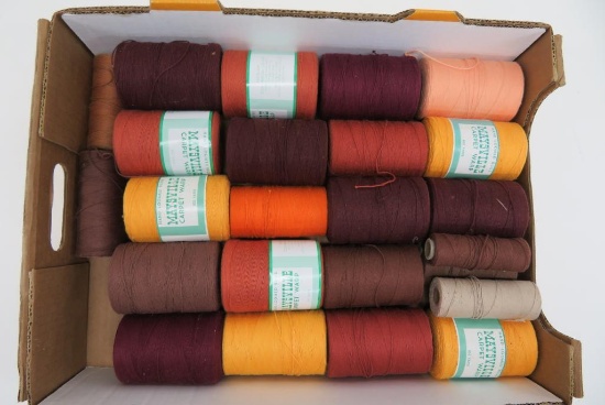 21 spools of Carpet Warp, Mayville, 4" tall, autumn colors