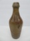 Tims Toledo stoneware bottle, 10