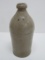 AWP stoneware bottle, 9 3/4