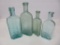 Four aqua medicine bottles, 5 1/2