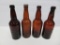 Four Schlitz, Pabst and Blatz amber beer bottles, heavily embossed