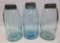 Three Atlas 1/2 gallon jars with zinc lids, blue