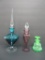 Three vintage colored perfume bottles,