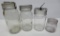 Four clear canning jars