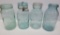 Four examples of blue canning jars, Sanitary, Fruit Keeper, Daisy and Star Glass, quart jars