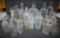A large assortment of clear bottles, medicine, liniment, liquor and ointment