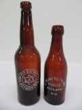 Two Ashland beer bottles, amber