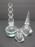 Three modernistic perfume bottles