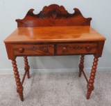 Flaming Mahogany table with two drawers and backsplash