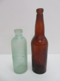 Two Ashland beer bottles, aqua hutch and amber
