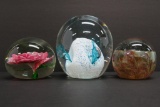 Three lovely paperweights, 2 1/4