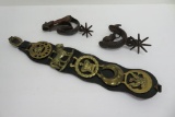 Western spurs and leather harness decoration with brasses