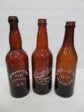 Three amber Oshkosh Beer Bottles, Wisconsin, 10