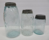 Three aqua Mason Jars, 1/2 gallon, quart and pint