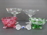 Four ornate candy dishes and crystal knife rest
