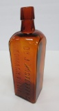 Amber Dr J Hostetter Stomach Bitters bottle, 8 1/2