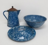 Three pieces of blue and white swirl enamelware