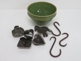 Stoneware bowl, cookie cutters and wrought metal pot hooks
