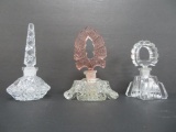 Three vintage perfume bottles, 4