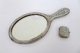 Ornate hand mirror and Woodworth compact, New York-Paris