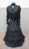 Early Victorian dress with bonnet on dress form