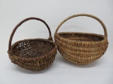 Two woven buttocks baskets, gathering baskets with twig handles