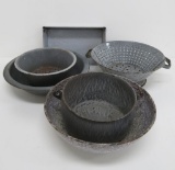 Six pieces of grey enamelware, bowls, pans and strainer, 7