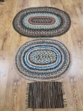 Braided rugs, two oval and one mat