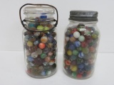 Two canning jars of vintage marbles, machine made