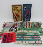 Brightly colored woven textiles and needlepoint wall art