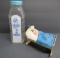 Two baby banks, glass bottle and metal baby cradle