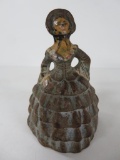 Cast Iron lady paperweight, ruffled skirt, 4 1/2