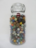 About 400 vintage marbles in old canning jar, machine made