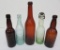 Five colored Milwaukee area brewery bottles