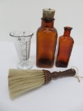 Vintage amber photographic bottles and measure