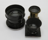 Three antique Bausch & Lomb camera lenses