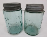 Two blue aqua Mason pint jars