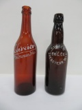 Two Sheboygan amber beer bottles, amber, crown and applied