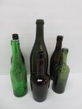 Six vintage colored bottles, 8 1/2