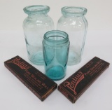 Three aqua canning jars and two boxes of sealing wax