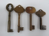 Four vintage brass skeleton keys