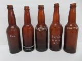 Five Wisconsin brewery amber bottles, crown top