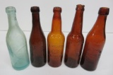 Five vintage beer bottles