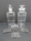 Two antique apothecary bottles and three glass labels