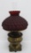 Bradley and Hubbard oil lamp with quilted ruby glass shade, 19