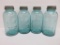 Four half gallon blue canning jars with zinc lids, 9